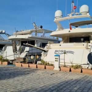 Elegant yachts docked at Sousse Marina under a clear blue sky, showcasing maritime luxury.